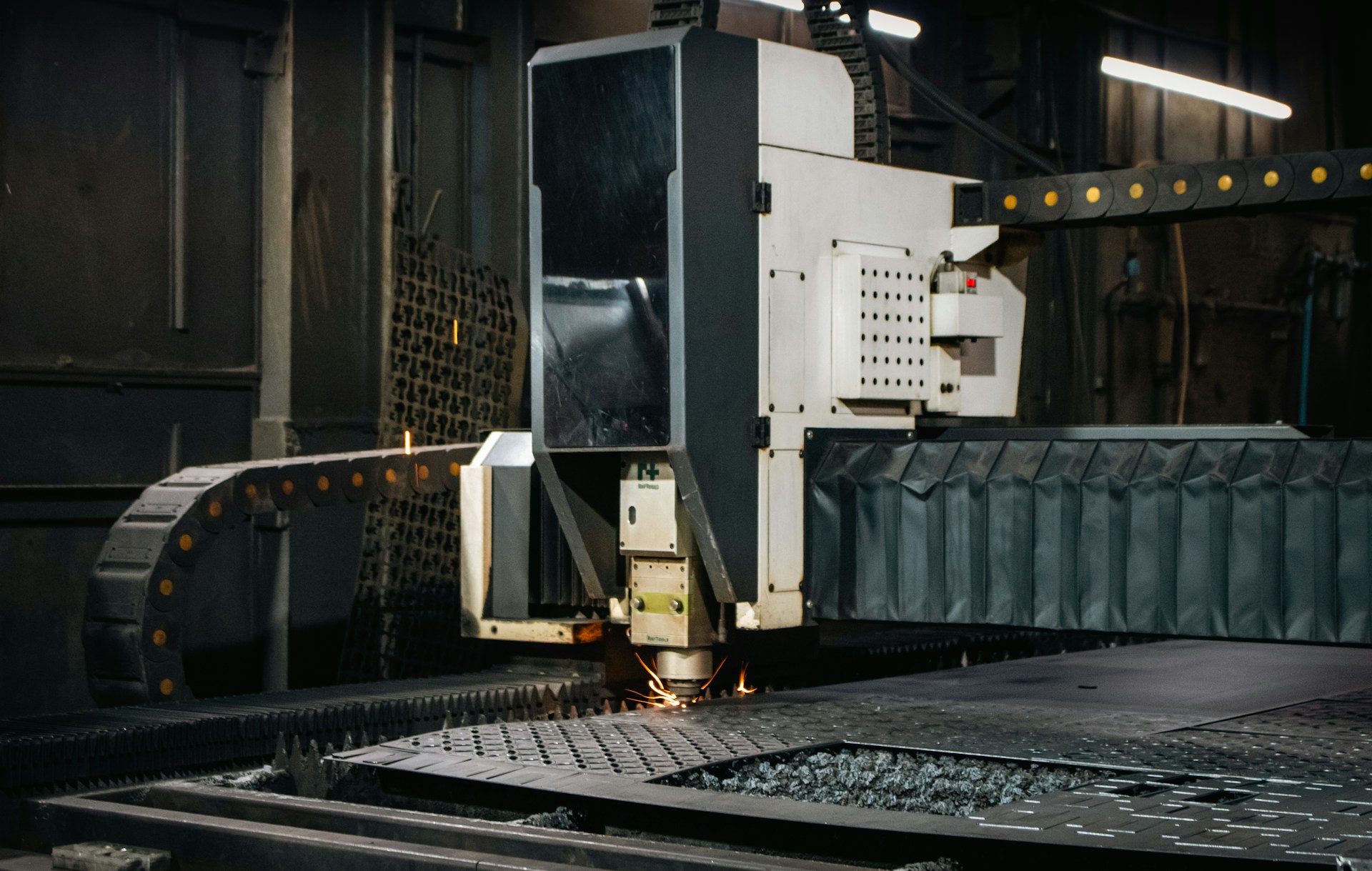 CNC fibre laser cutting machine in operation at Forge Laser Cutting, Warkworth